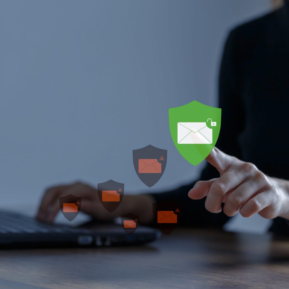 Business woman using computer to access email with anti-spam e-m