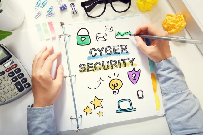 Person drawing Cyber Secruity concept on white paper Why cybersecurity is important for small businesses